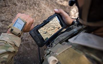 Soldier looking at end user device 